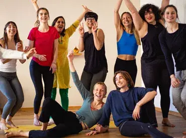 A group of cheerful women posing and laughing together